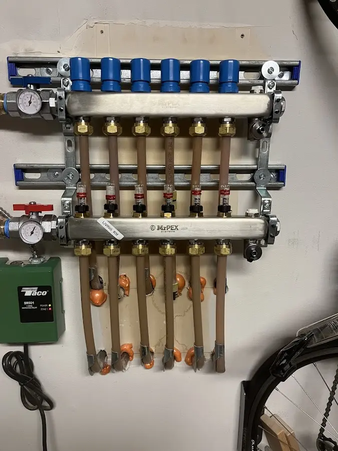 Plumber performing Water Heater Repair at a residential property in Country Club Hills